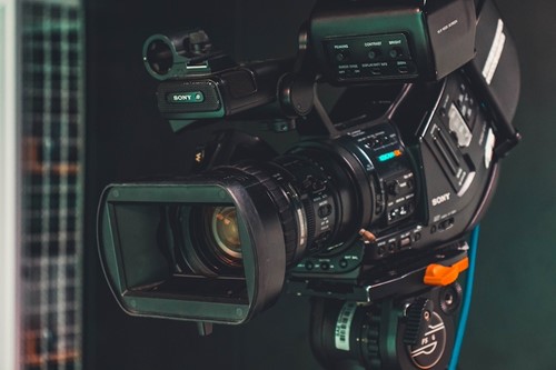 A close up shot of the front of a television camera