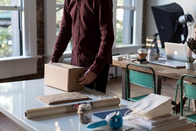 An employee packs up their office belongings